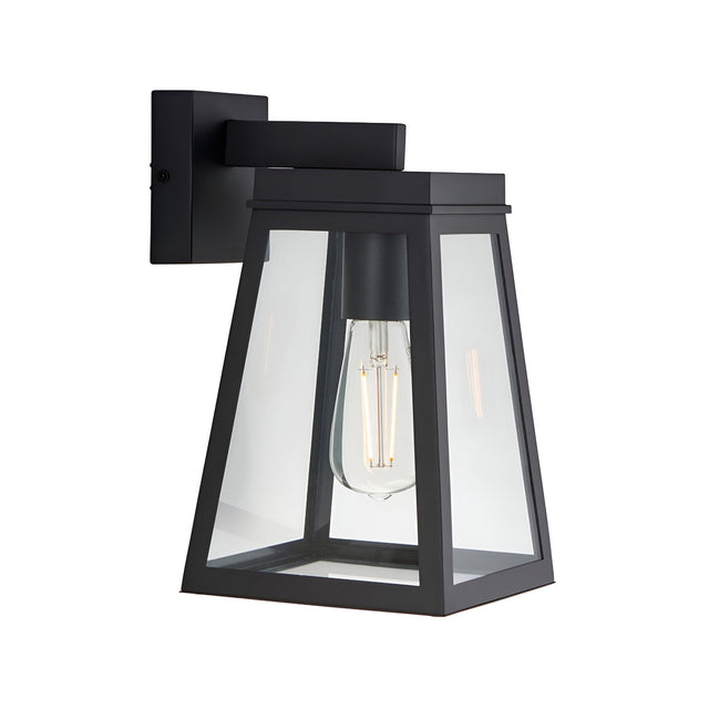 Caldwick Wall Light in matt black, a lantern-style fixture with clear glass panels and an angled bracket, shown against a plain white background.