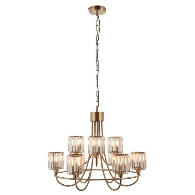 Clementine 9 Light Tiered Chandelier in antique brass with faceted crystal-glass shades, suspended on an adjustable chain against a plain white background.