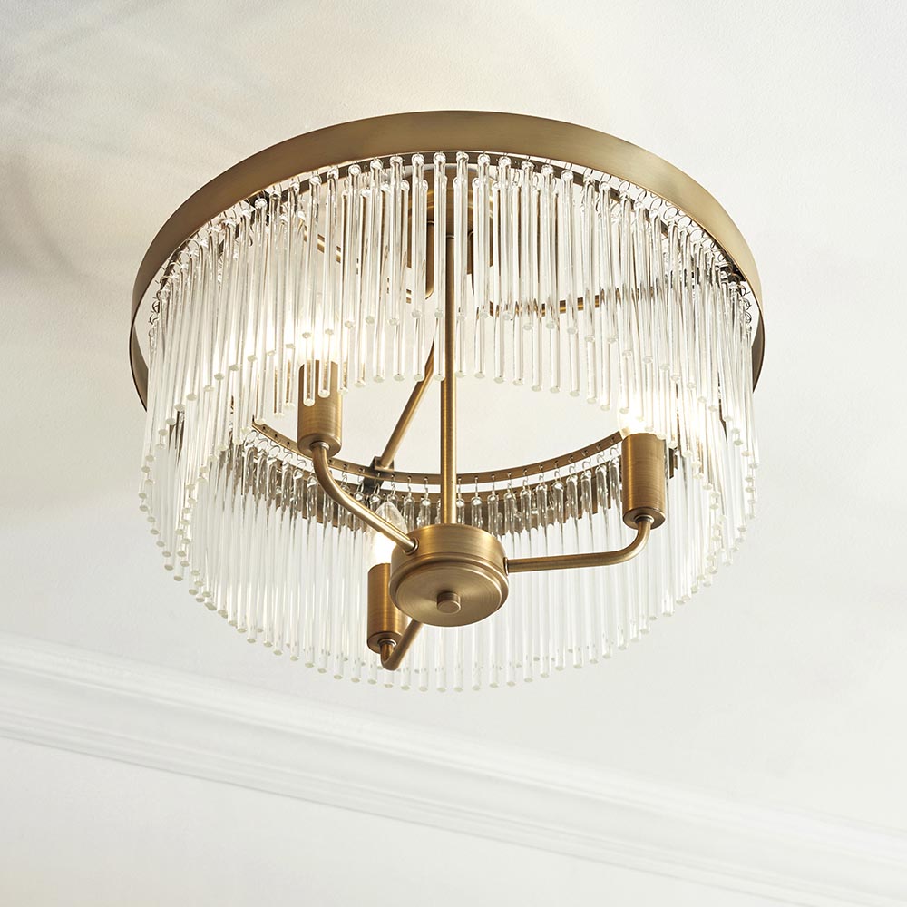 Endon Chatsworth 3 Light semi-flush ceiling light in antique brass with tiered glass rod shades, viewed from below against a white ceiling.