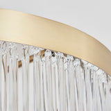 Close-up of the Endon Chatsworth semi-flush ceiling light showing its antique brass circular band above a fringe of clear glass rod shades.