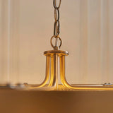 Close-up of Endon Chatsworth 5 Light Pendant showing antique brass central hub, curved arms and grey fabric cable on adjustable chain.