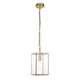 Haddon Pendant in brushed brass, single-light lantern-shaped fixture with clear glass panels and exposed E27 bulb, hung from a brass chain.