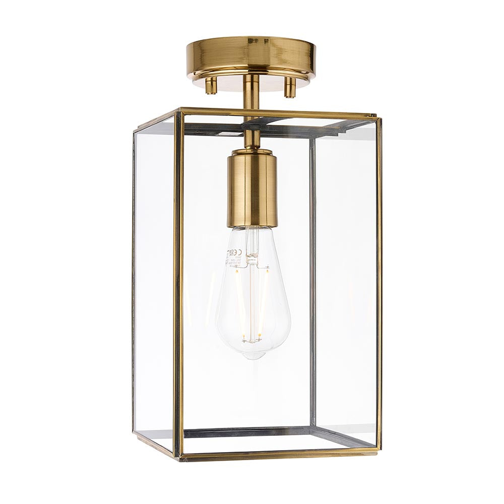 Endon Haddon flush ceiling light in aged brass with a rectangular clear glass shade and single E27 bulb, shown on a plain white background.