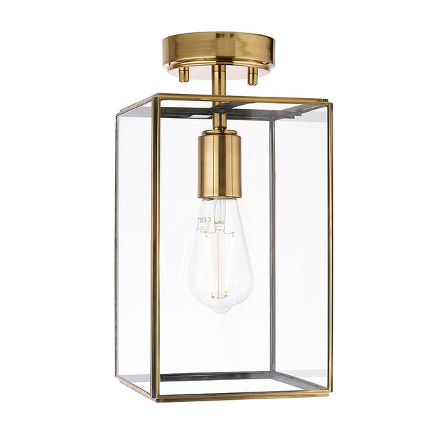 Endon Haddon flush ceiling light in aged brass with a rectangular clear glass shade and single E27 bulb, shown on a plain white background.