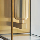 Close-up of the Haddon Wall Light in antique brass, showing the box-lantern frame, glass panel, and bracket detail with brushed brass finish.