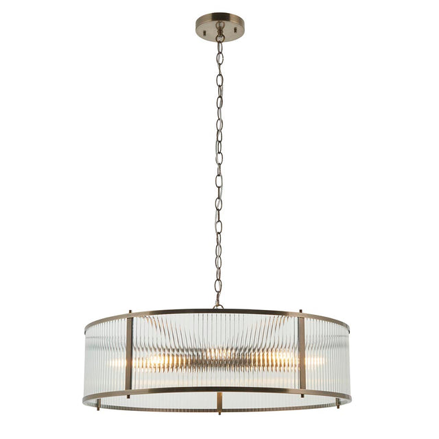 Endon Rothbury 8 Light Pendant in antique brass with a large drum frame of clear ribbed glass panels, suspended on a chain against a white background.