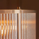 Close-up of Endon Rothbury 8 Light Pendant in antique brass, showing clear ribbed glass panel shades and the brushed brass top frame.