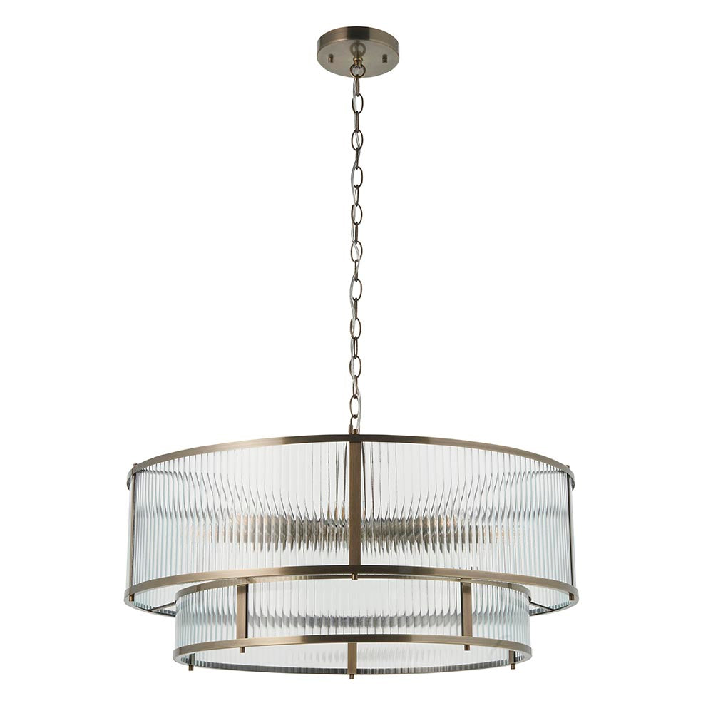 Endon Rothbury 8 light tiered chandelier in antique brass with clear ribbed glass panels over two tiers, suspended on a chain against a white background.