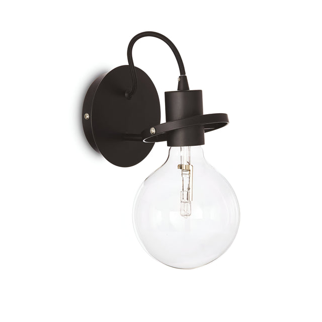 The Lunaria Wall Light - Black features a minimalist design with a contemporary flair. Its matte black finish pairs seamlessly with the round base, and the large clear bulb lends an elegant touch to any space.