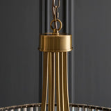 Close-up of the Endon Fairfax 8 Light Pendant showing the antique brass cap, chain loop and grey fabric cable against a dark grey background.