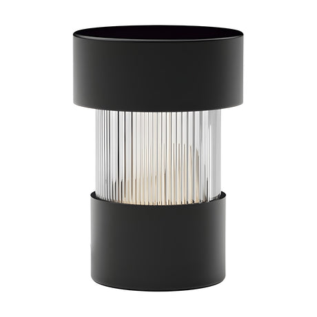 Balise LED rechargeable table lamp with a ribbed glass cylinder between matt black iron bands, shown on a plain white background.