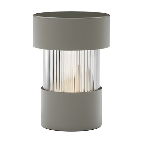 Balise LED Ribbed Glass Rechargeable Table Lamp in green, a cylindrical design with iron cap and base framing a fluted glass shade, shown on a plain white background.