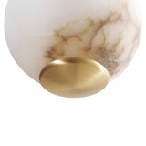 Close-up of the Lumina 3 Light Orb Alabaster Single Pendant Light, featuring smooth brass accents on a white and beige marbled glass surface, highlighting the elegance of modern lighting in soft white and brass tones.