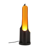 The Stealth Table Lamp - Brass & Black features a sleek black base and a tall brass diffuser for a warm glow, finished with a minimalist black cord for effortless style.