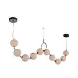 The Luxoria 10 Light Alabaster Suspension Light – White showcases a modern design with spherical white glass shades connected by metallic joints, hanging from two round ceiling mounts on wires.