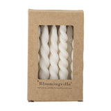 Kraft box with window showing Twist Candles Pack of 12 in White, slim spiral paraffin candles visible inside, Bloomingville branding printed below.