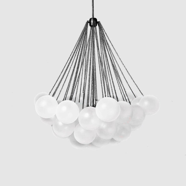 The Orb 17 Light Cluster Suspension - Black showcases frosted white glass spheres suspended by black cables from a central black frame, set against a plain light gray background.