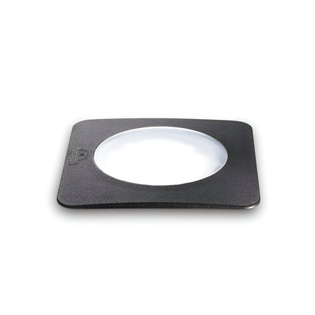 A square, grey-framed recessed ground light with a transparent center is artfully displayed against a plain white background, evoking the sleek durability akin to an IP67 rating.