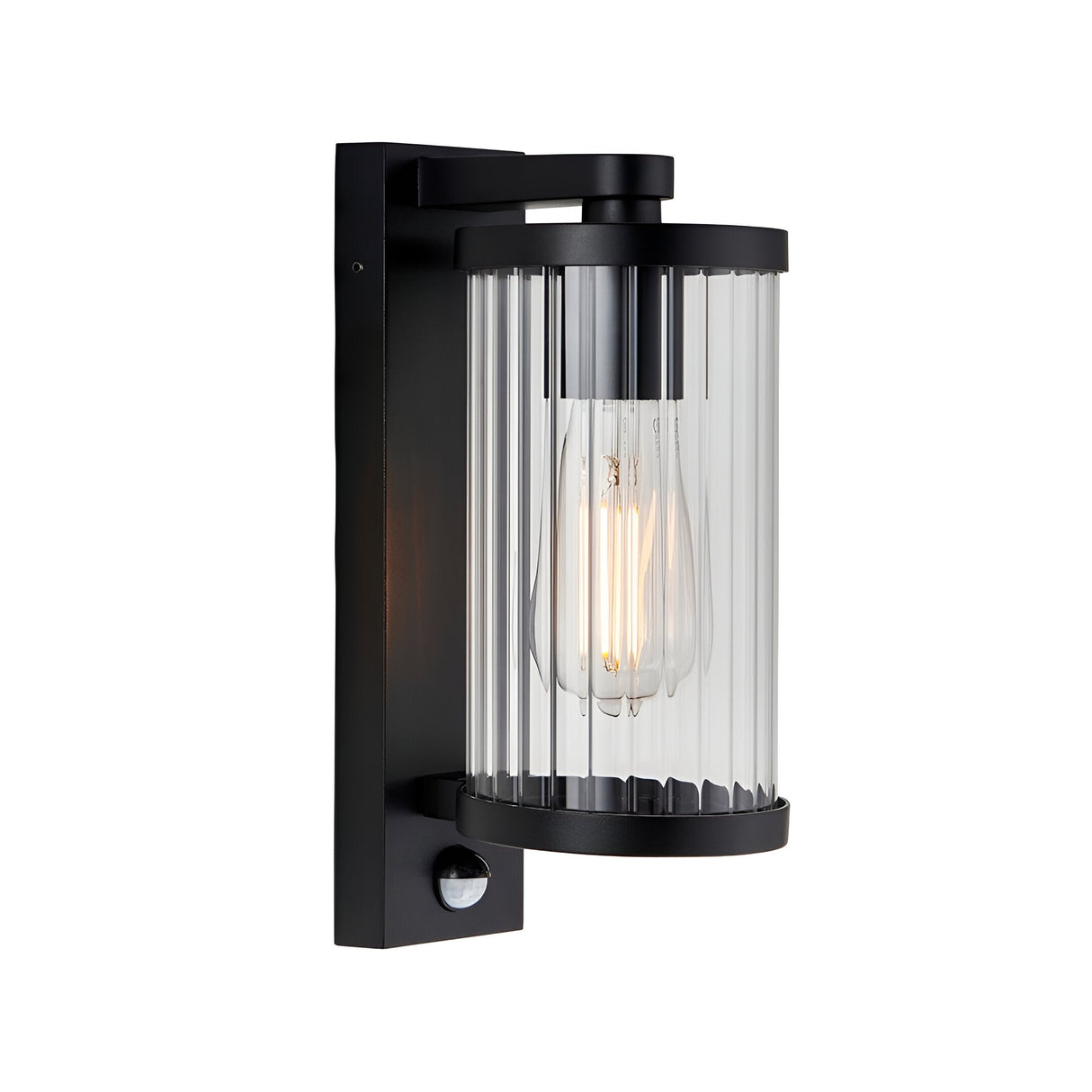 Endon Castbury outdoor wall light in matt black with a cylindrical ribbed glass shade, E27 filament bulb and integrated PIR sensor below.