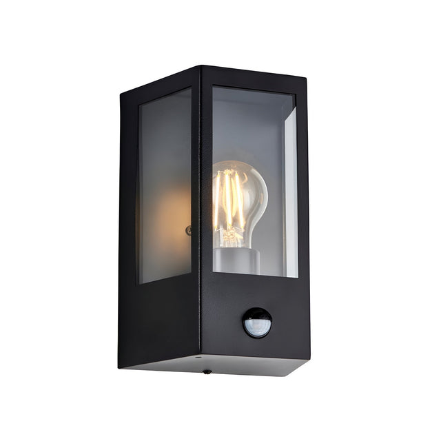 Brenshaw Outdoor Wall Light in matt black with cubed metal frame, clear glass panels, exposed E27 bulb, and built-in PIR motion sensor.