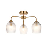 Endon Halstead Ribbed 3 light semi-flush ceiling light in aged brass with three curved arms and ribbed glass tulip shades, on a white background.