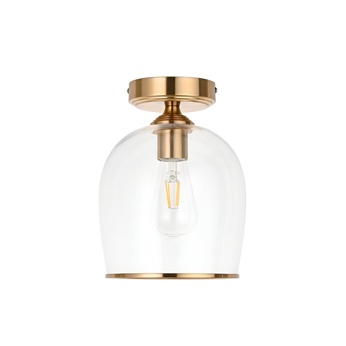 Halstead Flush Ceiling Light in aged brass with clear glass bell shade and exposed E27 bulb, shown on a plain white background.