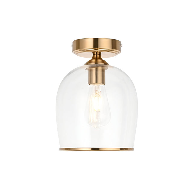 Halstead flush ceiling light in aged brass with a clear dome glass shade and exposed E27 bulb, shown on a plain white background.