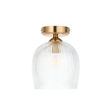 Endon Halstead flush ceiling light with ribbed clear glass dome shade and aged brass fitting, shown against a plain white background.