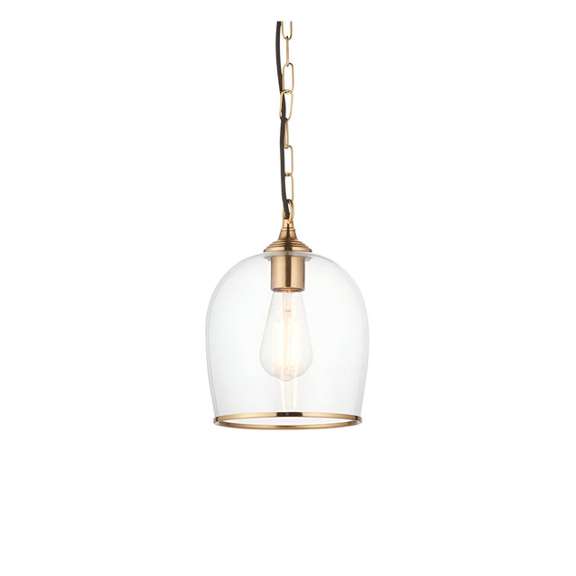 Halstead Pendant in brass with a clear glass dome shade, exposed bulb, and black chain suspension on a plain white background.
