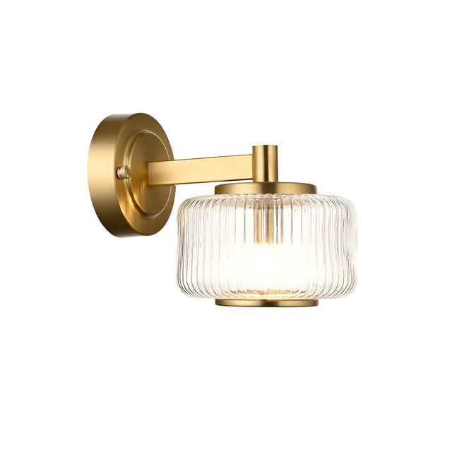 Endon Rutland wall light in brushed aged brass with a ribbed clear glass shade and plated metal trim, shown on a plain white background.