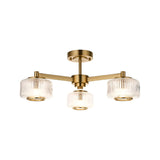 Endon Rutland 3 light semi-flush ceiling light in aged brass with three ribbed glass shades on splayed arms, shown on a white background.