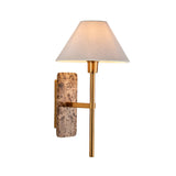 Bramble Wall Light with a marble-effect brown stone backplate, brass-toned arm and tapered white linen shade, shown on a plain white background.