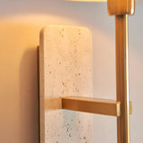 Bramble Wall Light in Brass & Natural, close-up of natural stone backplate with veining and slim brass-toned arm against a light wall.