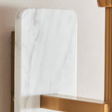 Bramble Wall Light close-up showing white marble backplate with grey veining and brushed brass arm mounted on a light wall.