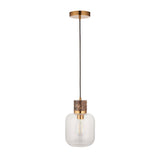 Cranstead single pendant light with clear rounded glass shade, brown marble top and brass collar, suspended from a black cord on a white background.