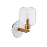 Cranstead Wall Light with white marble backplate, brass arm and clear glass shade housing an exposed bulb, shown on a plain white background.