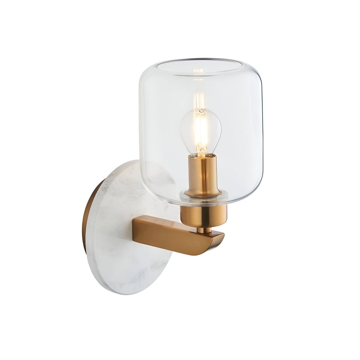 Cranstead Wall Light in Brass & White featuring a round white marble backplate, brass arm and clear glass shade with visible bulb, shown on a plain background.