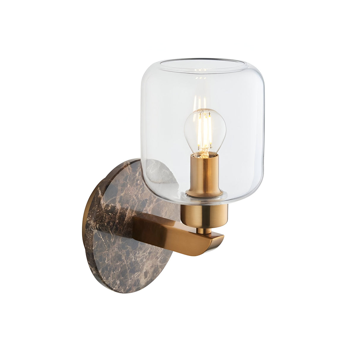 Cranstead Wall Light in brass with a dark brown Emperador marble backplate, clear glass shade and visible filament bulb, shown on a plain white background.