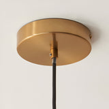 Endon Cranton pendant light brushed brass ceiling rose with black fabric flex cable mounted to a white ceiling.
