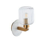 Cranton Wall Light in Brass & White with round marble backplate, brass arm and ribbed glass shade showing filament bulb, on plain background.