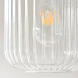 Close-up of the Cranton Pendant Light showing its clear ribbed glass shade with a visible E27 bulb, set against a plain light background.