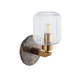 Cranton Wall Light in brass and brown, featuring a round Emperador marble backplate, brass arm, and ribbed clear glass shade, shown on a white background.