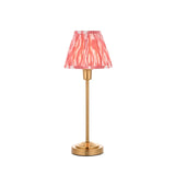 Endon Cliffbourne Ikat table lamp with slim brushed brass stepped base and pleated pink ikat-print faux silk tapered shade, on a white background.