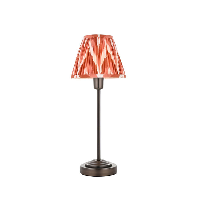 Endon Cliffbourne Zigzag table lamp with slim bronze stepped base and tapered pleated shade in apricot orange zigzag print, on a white background.