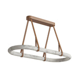 The Cintura LED Medium Alabaster Floating Suspension Light – Soft White is a modern sculptural oval fixture with a marble-like finish, suspended by four brown leather straps from a matching rectangular ceiling mount, isolated on white.