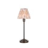 Cliffbourne Ikat Table Lamp in bronze with a slender stepped metal base and pleated, tapered striped ikat fabric shade, shown on a white background.