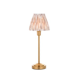 Endon Cliffbourne Ikat table lamp with brushed brass stepped base, slim stem, and pleated tapered Ikat shade in pink and grey tones on a white background.