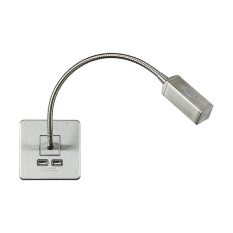 This stylish LED dimmable reading light in brushed chrome boasts a flexible neck and rectangular base, complemented by a dual USB charger for extra convenience. Its head is equipped with an oval button for effortless operation.