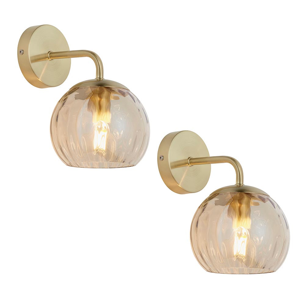 Endon Draycott twin pack wall lights with champagne dimpled glass globe shades on satin brass arms and round back plates, shown on a white background.
