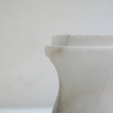 Close-up of the Morfia Small Mushroom Alabaster Table Lamp, showing carved white alabaster stem with soft grey veining against a plain light background.
